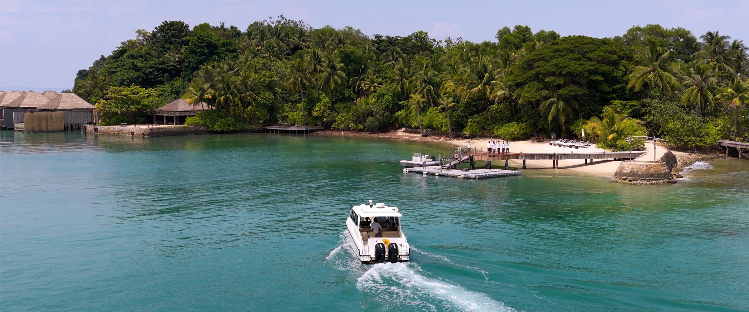 Guest boat arriving at a private island resort