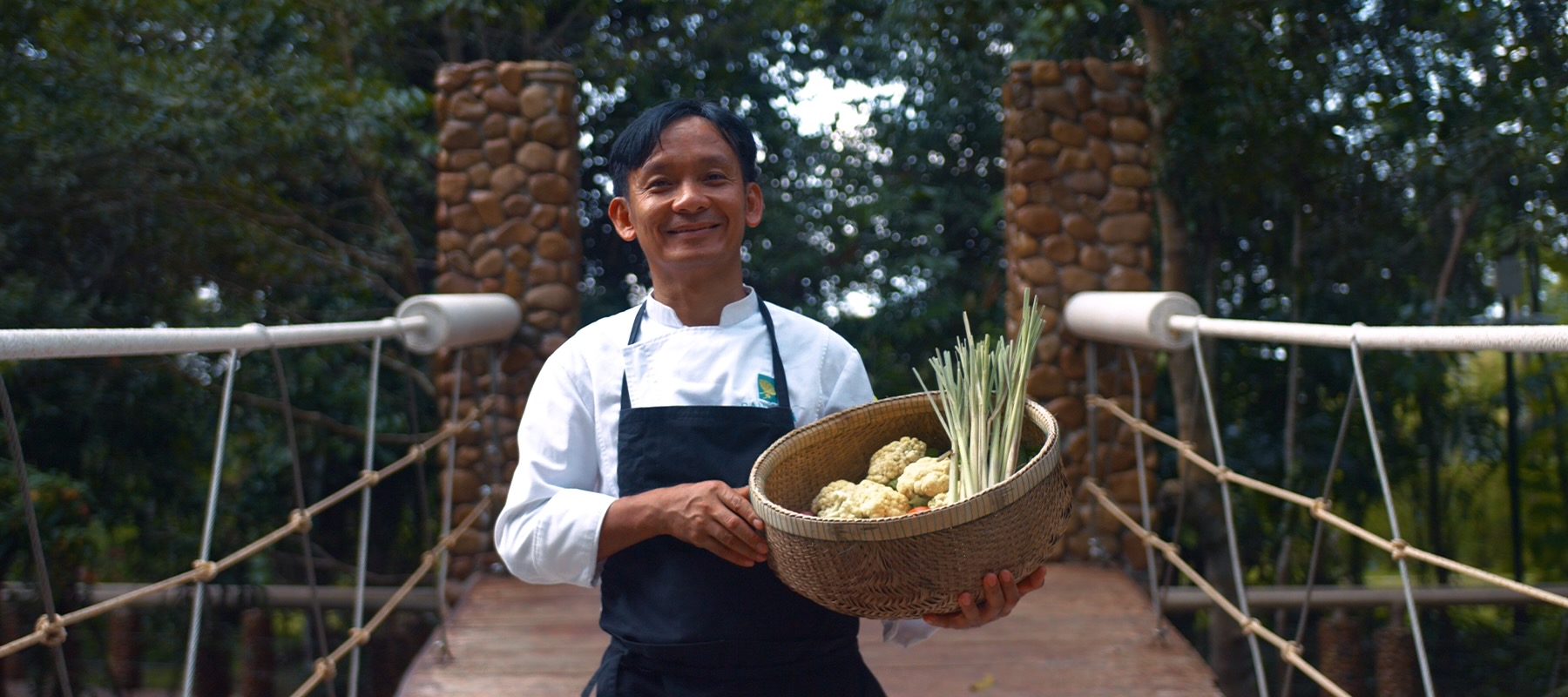 Chef with a basket of fresh ingredients